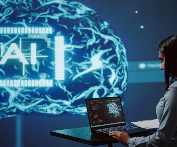AI specialist reviews data charts, working in tech industry